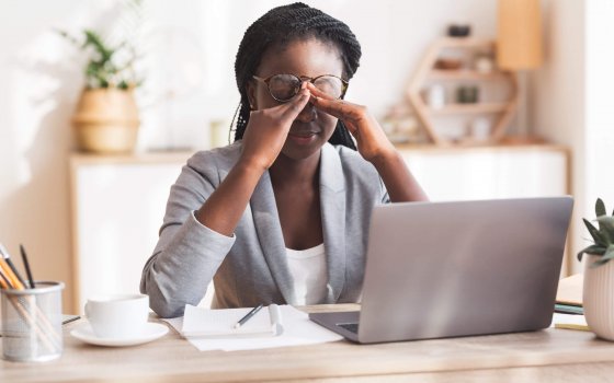 Eye Strain. Overworked Black Businesswoman Massaging Nosebridge At Workplace Having Eyesight Problem, Selective Focus